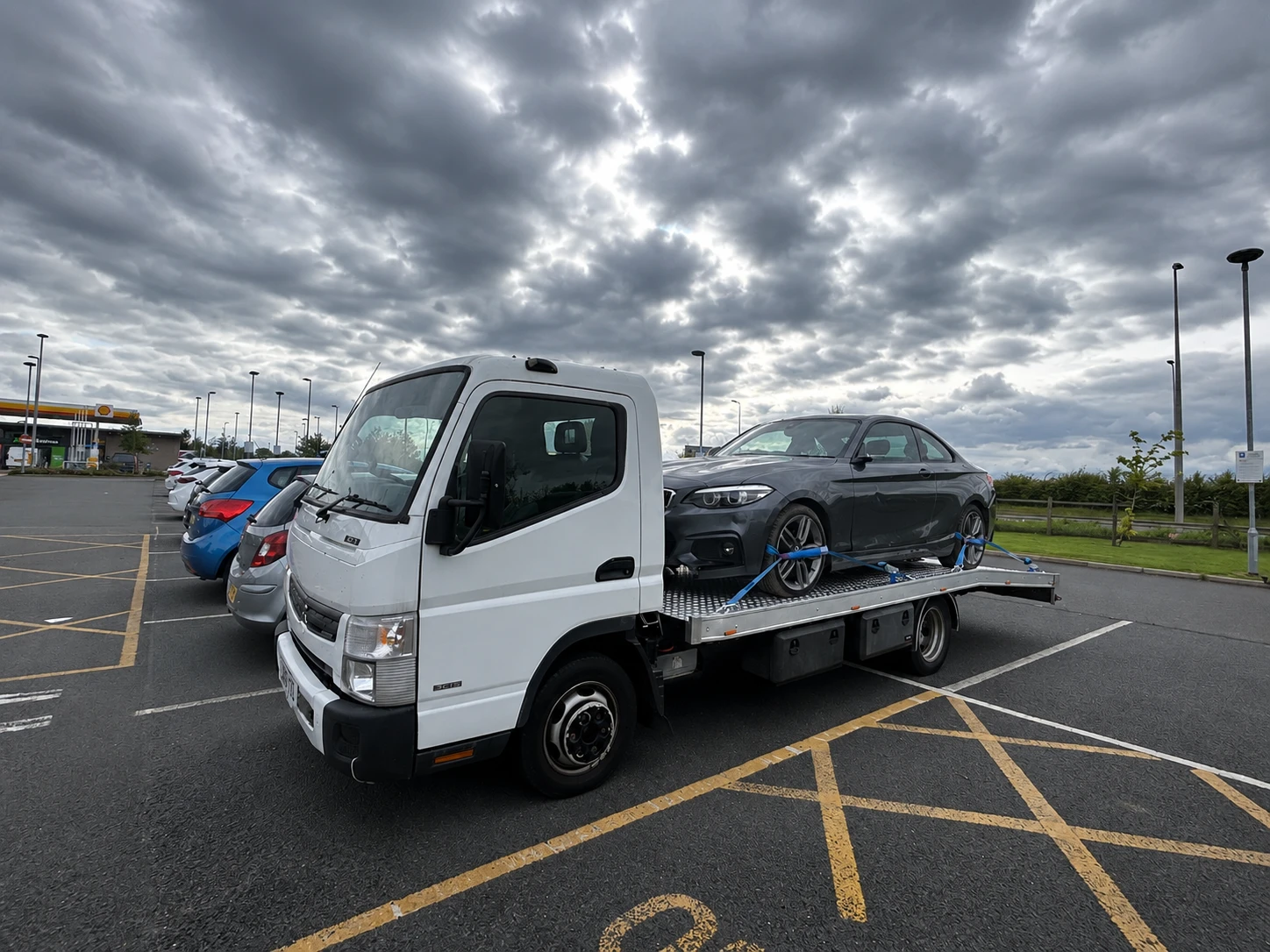 Hard shoulder recovery driver helping breakdown customer