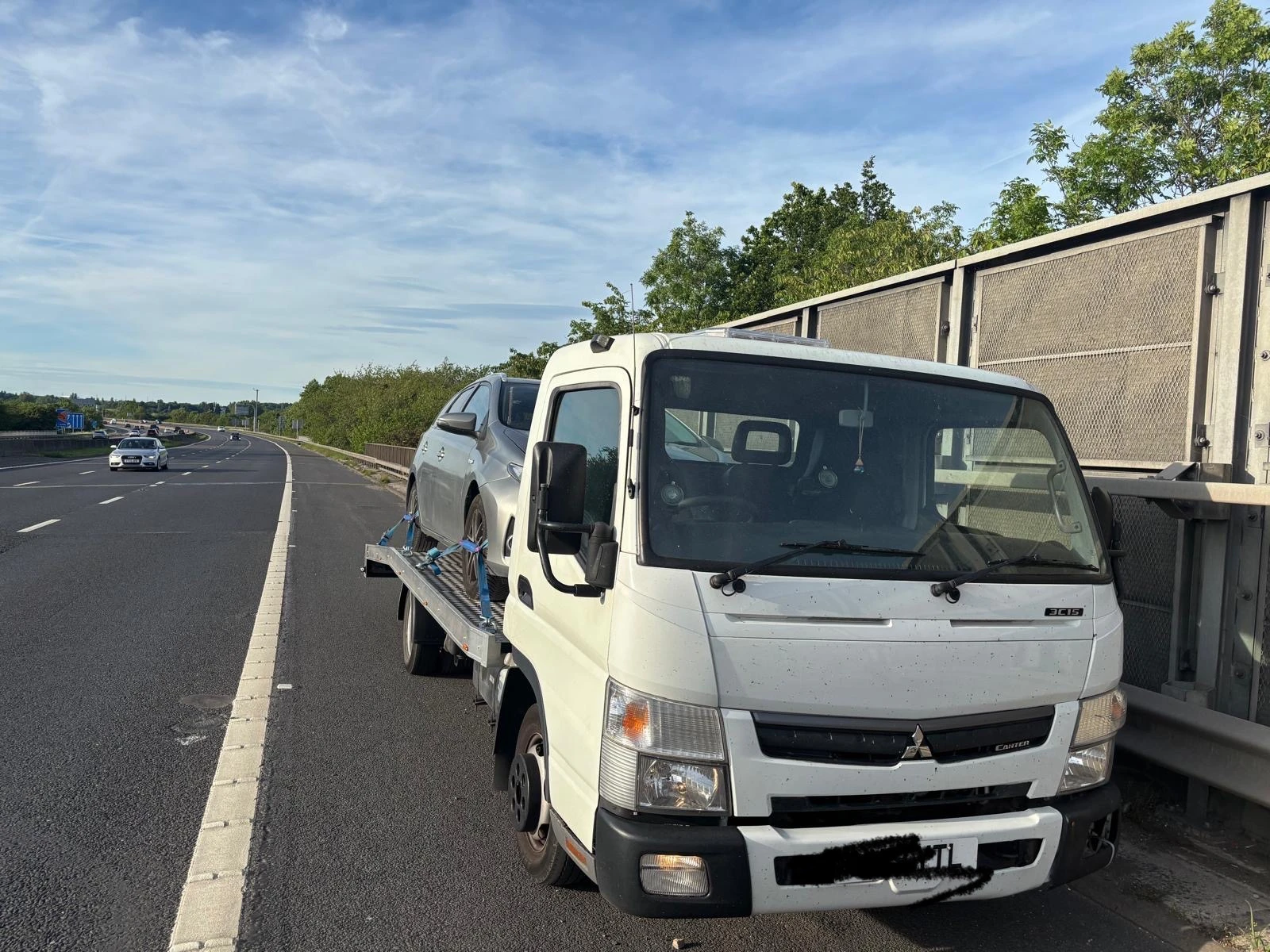 Motorway hard shoulder tow truck breakdown recovery